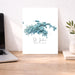 Poster of St. John, U.S. Virgin Islands with a blue abstract design on a desk.