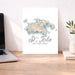 Map of St. John, U.S. Virgin Islands on a desk with a laptop and plant.