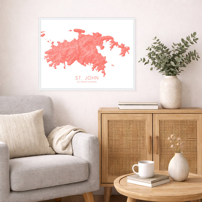 Living room with a gray sofa, wooden cabinet, and decorative items including a pink abstract art print.