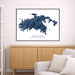 Framed map of Saint John, United States Virgin Islands, on a wall above a wooden cabinet and sofa.