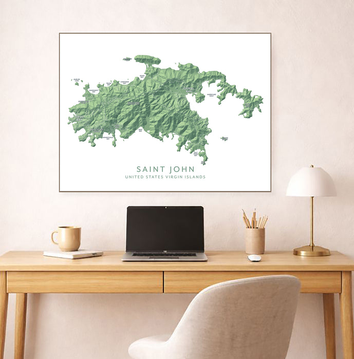 Framed map of Saint John, United States Virgin Islands on a wall above a desk.