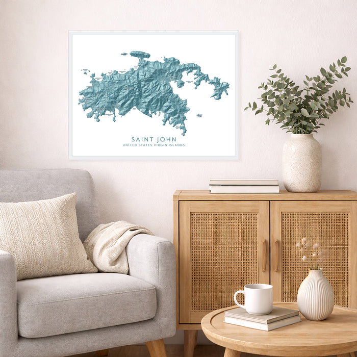 Framed map of Saint John on a wall above a sofa in a living room.