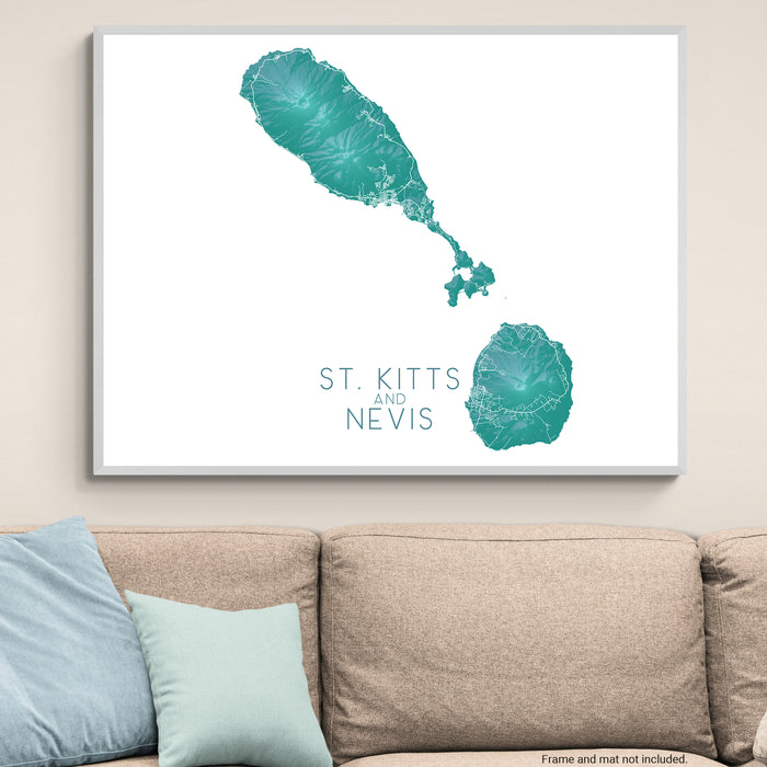 Framed map of St. Kitts and Nevis on a wall above a sofa.