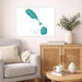 Living room with a gray sofa, wooden cabinet, and decorative items including a map of St. Kitts and Nevis.