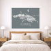Framed map of St. Thomas above a bed in a bedroom setting