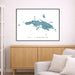 Framed map of St. Thomas on a wall above a wooden cabinet and sofa.