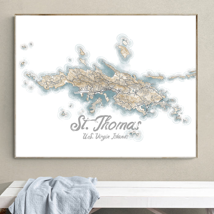 Framed map of St. Thomas, U.S. Virgin Islands on a wall above a white bench.