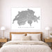 Map of Switzerland on a wall above a bed in a bedroom setting