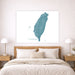 Map of Taiwan on a wall above a bed in a bedroom