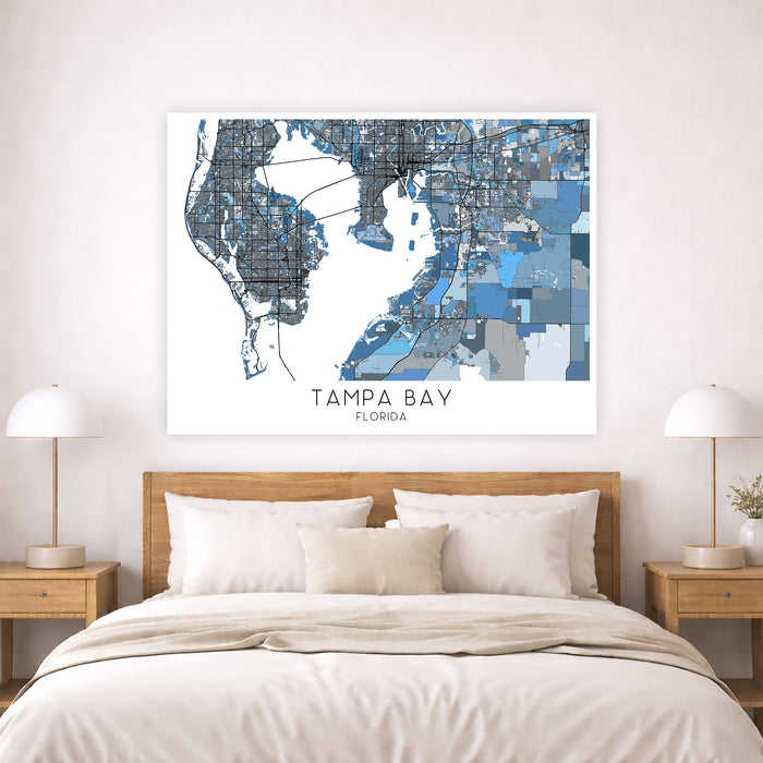 Framed map of Tampa Bay, Florida above a bed in a bedroom setting.