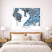 Framed map of Tampa Bay, Florida above a bed in a bedroom setting.