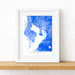 Framed map of Tampa Bay with a blue and white color scheme on a white wall.