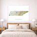 Map of Tennessee on a wall above a bed in a bedroom setting