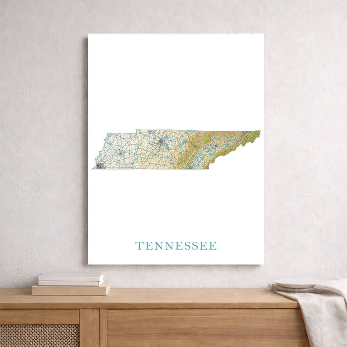 Framed map of Tennessee on a wall above a wooden shelf.