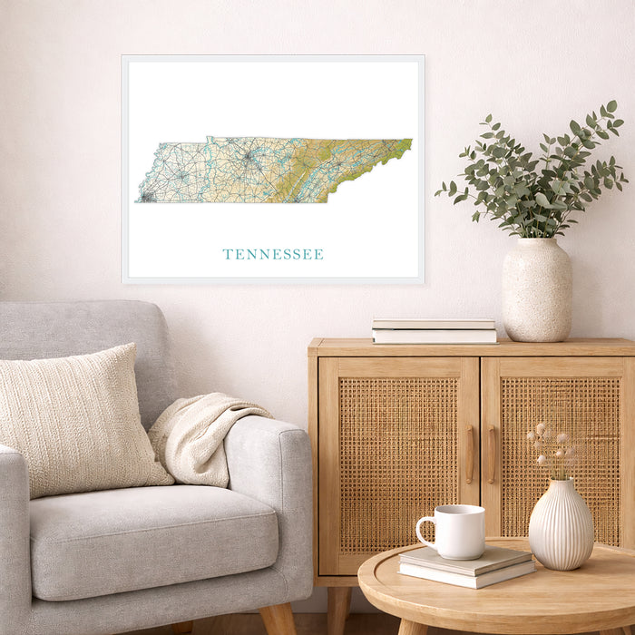 Framed map of Tennessee on a wall above a sofa with a wooden cabinet and table in a living room.