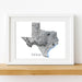 Framed map of Texas on a white wall