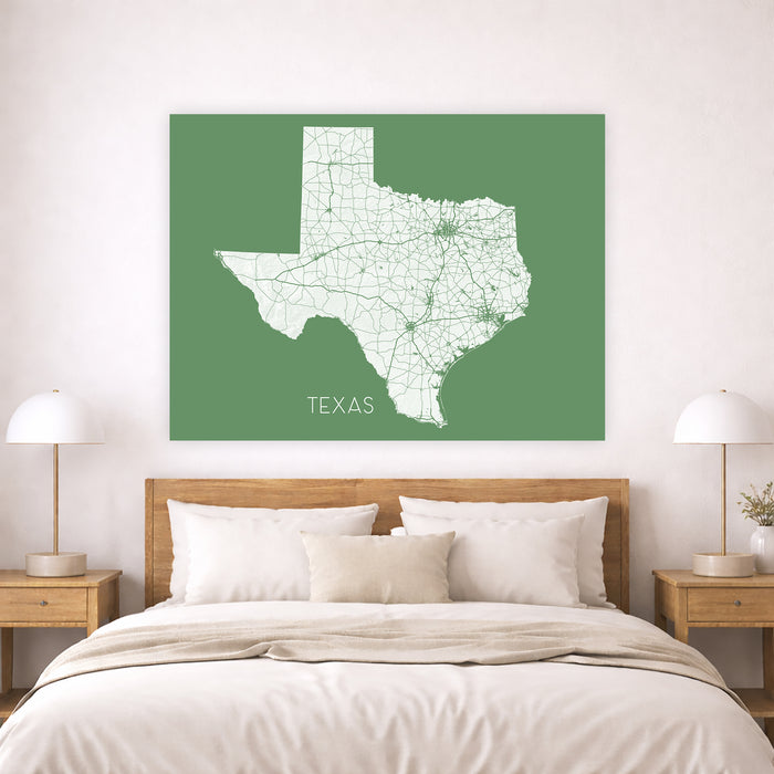 Map of Texas on a green background above a bed in a bedroom setting