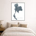 Framed map of Thailand on a wall above a bed in a bedroom.