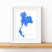 Framed map of Thailand on a white wall