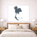 Map of Thailand on a wall above a bed in a bedroom setting