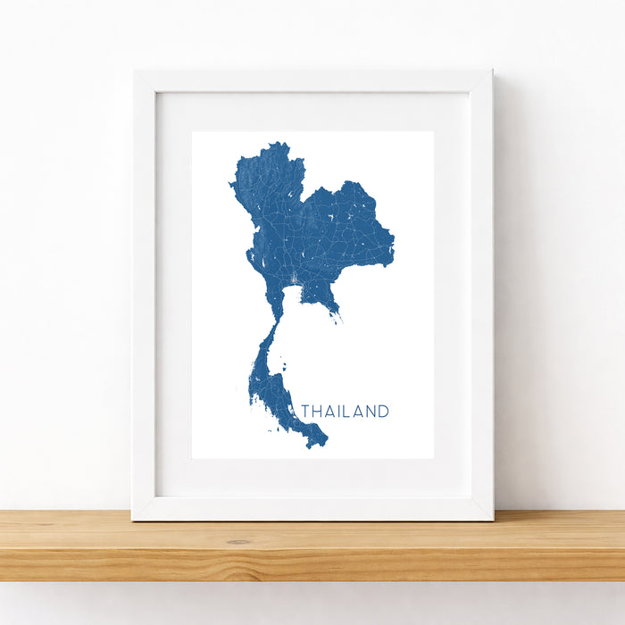 Framed map of Thailand on a white wall