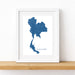 Framed map of Thailand on a white wall