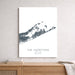 Map of The Hamptons, Long Island, New York on a white wall above a wooden shelf.