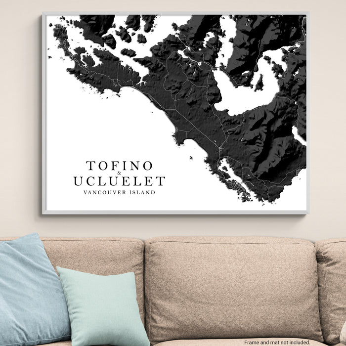 Map of Tofino and Ucluelet on Vancouver Island displayed on a wall above a couch.