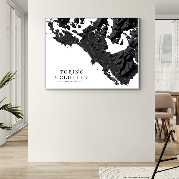 Framed map of Tofino Ucluelet Vancouver Island on a wall in a modern interior setting.