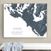 Framed map of Tofino and Ucluelet on Vancouver Island against a beige wall.