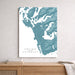 Map of Tofino and Ucluelet on a wall above a wooden shelf.