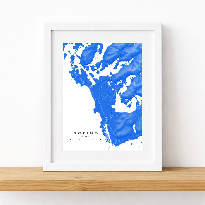 Framed map print of a coastal area with blue water and white landmasses on a white background.