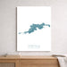 Map of Tortola, British Virgin Islands on a white wall above a wooden shelf.