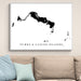 Framed map of Turks and Caicos Islands on a wall above a sofa.