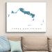 Framed map of Turks and Caicos on a wall above a sofa.