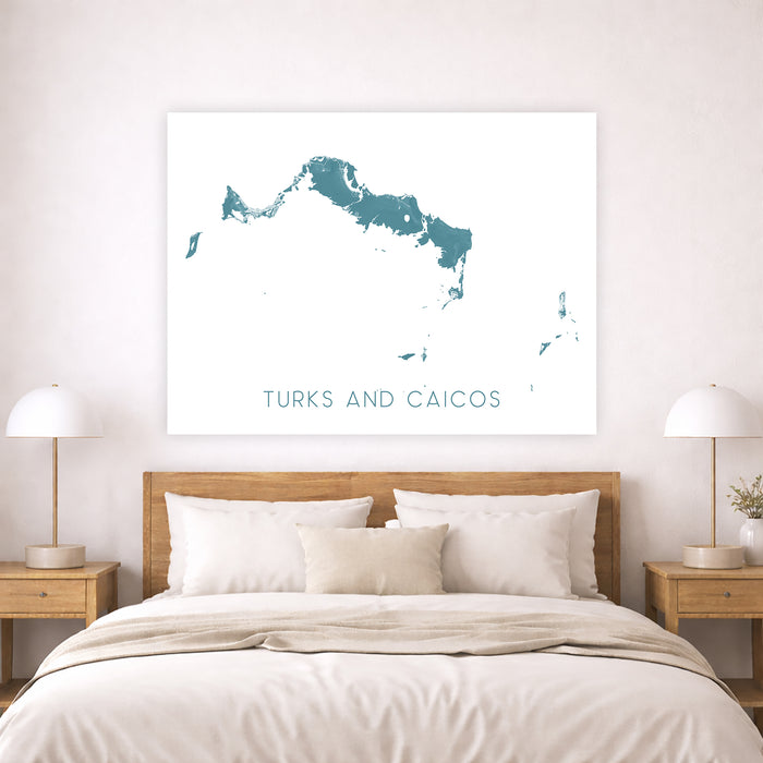 Framed map of Turks and Caicos above a bed in a bedroom setting