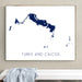 Framed map of Turks and Caicos on a wall above a white bench.