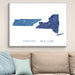Map of Tennessee and New York on a wall above a beige sofa with light blue pillows.