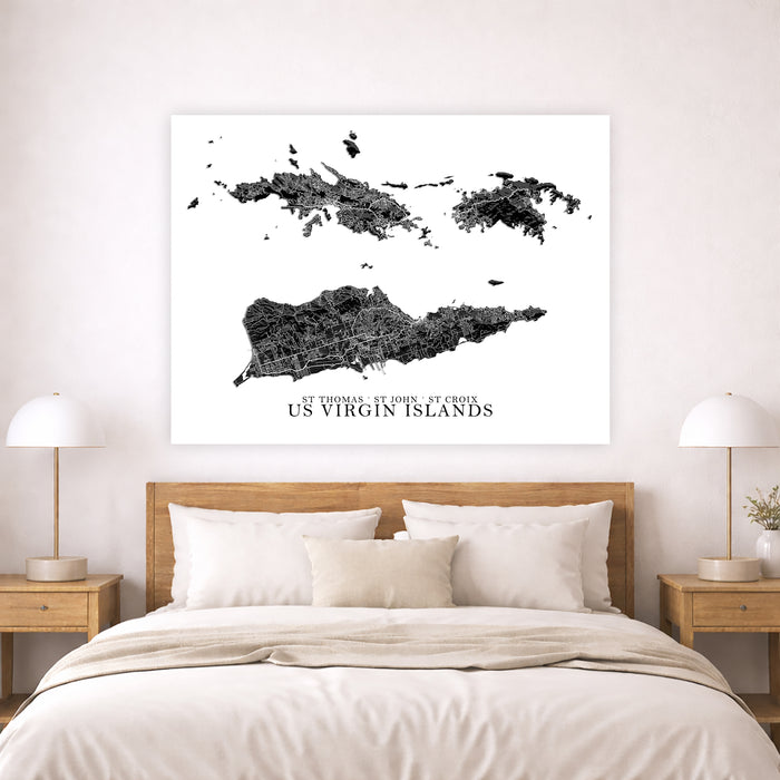 Framed map of US Virgin Islands above a bed in a bedroom setting