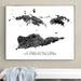Framed map of US Virgin Islands on a wall above a white surface.