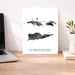 Map of US Virgin Islands on a desk with a laptop and plant