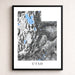 Framed map of Utah with topographic details on a white wall.