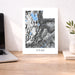 Map of Utah on a desk with a laptop and plant