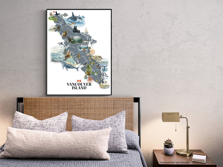 Framed map of Vancouver Island above a bed with pillows and a lamp.