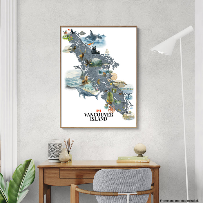 Framed map of Vancouver Island on a wall above a desk.