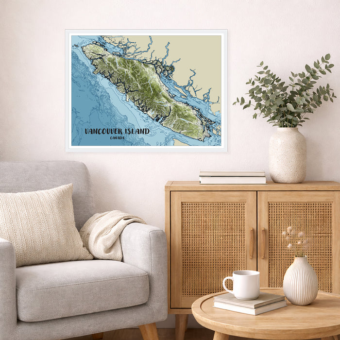 Living room with a map of Vancouver Island on the wall, a vase with plants, and a coffee table with books and a mug.