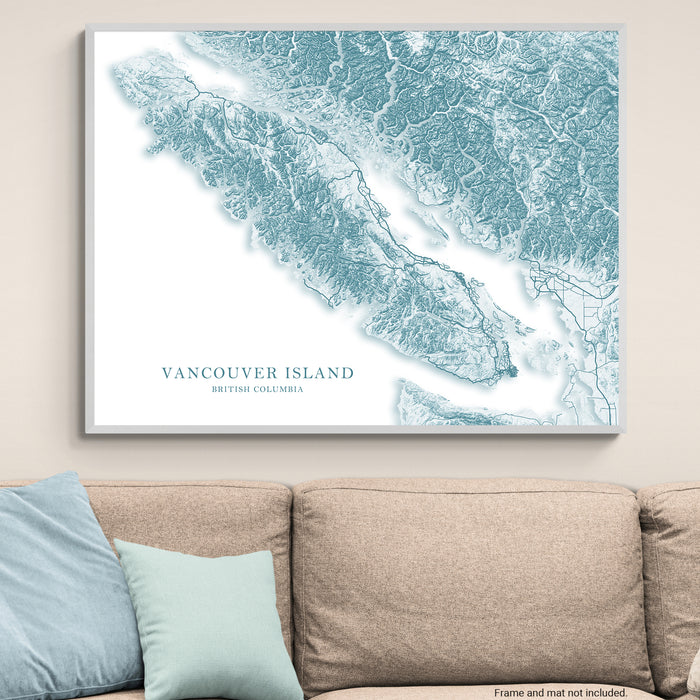 Topographic map of Vancouver Island on a wall above a beige sofa with light blue pillows.