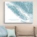 Topographic map of Vancouver Island on a wall above a beige sofa with light blue pillows.