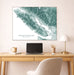 Map of Vancouver Island on a wall above a desk with a laptop and lamp.