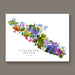 A square wall art print featuring a colorful floral map of Vancouver Island, Canada, with the text 'VANCOUVER ISLAND CANADA' printed below. The artwork is displayed against a neutral gray wall.
